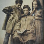 Three children look serious in a c. 1845 photograph. Back then, photographers told their subjects to "say prunes" to give them a more serious expression.