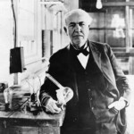 Thomas Edison holding a lightbulb in 1883. Between 1879 and 1883, Edison figured out how to extend a single lightbulb's lifetime from 14.5 hours to 1,200 hours.