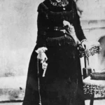 Belle Starr visited a portrait studio to take this 1887 photograph that showed off her pistols.
