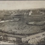 Before the third game of the 1903 World Series, fans swarmed the field, rushing into
the outfield and forcing police to clear the field before the game. Boston Public
Library
