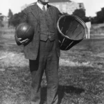 James Naismith, the inventor of basketball, holding a ball and basket. The sport
became popular before switching from baskets to hoops with nets. Wikimedia
Common